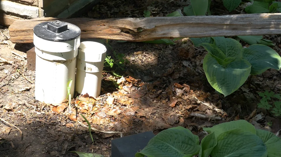 Exterior backwater valve risers at grade